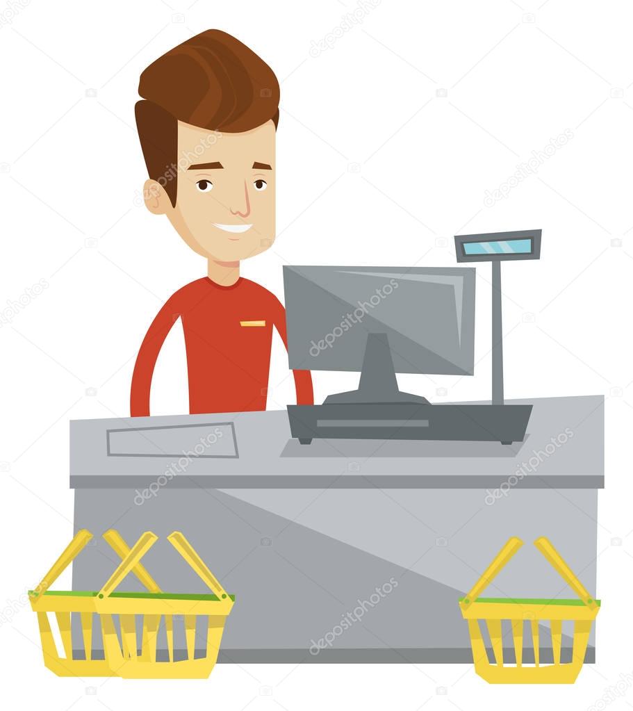 Cashier standing at the checkout in supermarket.