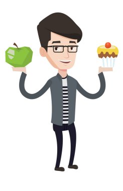 Adam elma ve cupcake arasında seçim yapma.