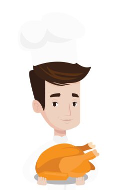 Şef tencere tutarak kavrulmuş tavuk.