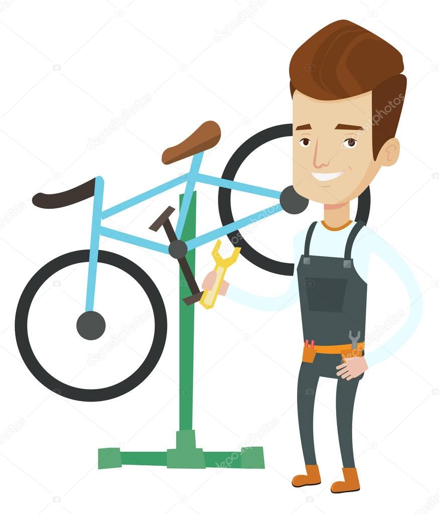 Caucasian bicycle mechanic working in repair shop.