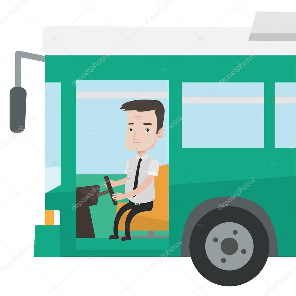Caucasian bus driver sitting at steering wheel.