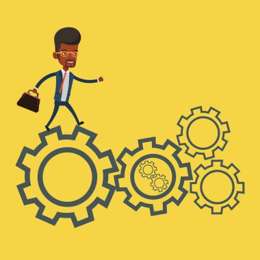 Cogwheels üzerinde çalışan iş adamı.