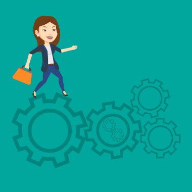 Cogwheels üzerinde çalışan iş kadını.