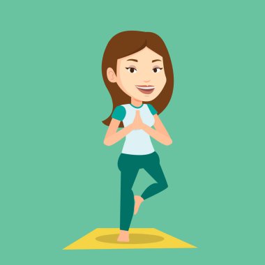 Genç kadın Yoga ağaç poz pratik.