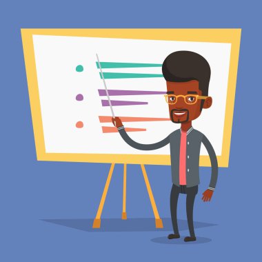 Öğretmen ya da öğrenci ayakta kurulu önünde.