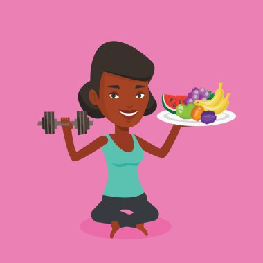 Meyve ve dumbbell ile sağlıklı kadın.