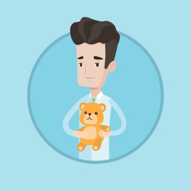 Çocuk doktoru doktor holding oyuncak ayı.