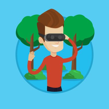 Sanal gerçeklik kulaklık parkta giyen adam.