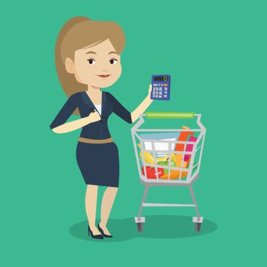 Kadın Müşteri Hesap makinesinde sayma.