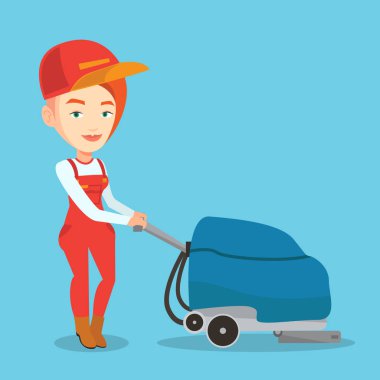 Kadın işçi deposu zemin temizleme makinesi ile.