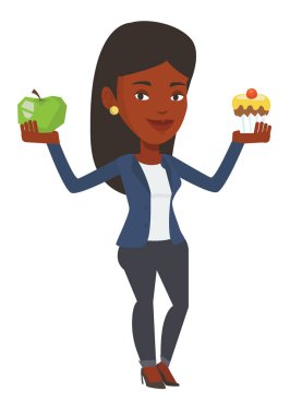 Kadın elma ve cupcake arasında seçim yapma.