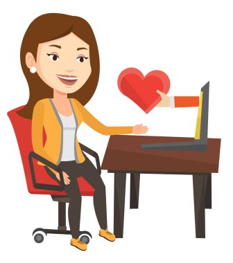 Genç kadın dating online dizüstü bilgisayar kullanarak.