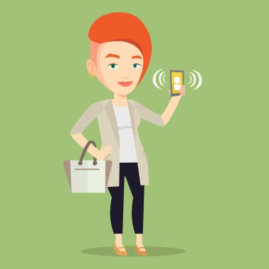 Kadın holding zil cep telefonu.