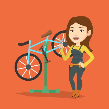 Tamir dükkanında çalışan Beyaz Bisiklet tamircisi.