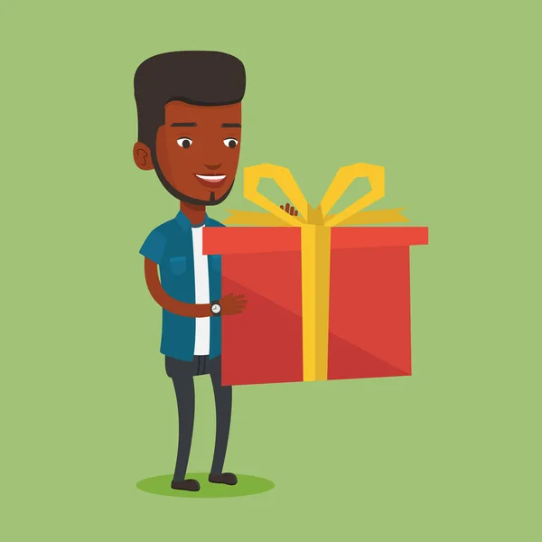 Örömteli afro-amerikai ember tartja ajándék doboz. — Stock Vector