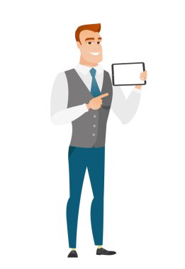 Smiling businessman holding tablet computer.
