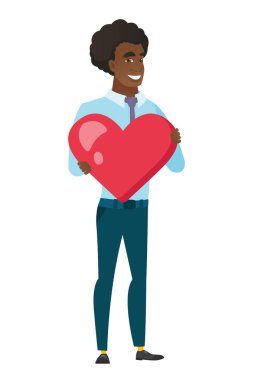 Büyük kırmızı bir kalp tutan beyaz iş adamı.