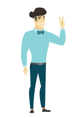 Asya işadamı zafer jest gösterilen.