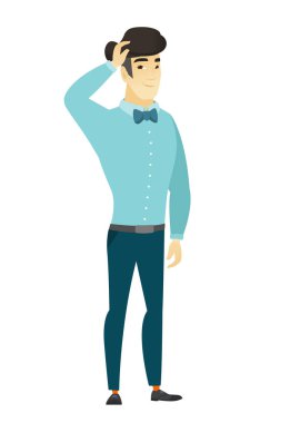 Genç Asyalı işadamı başını tırmalamak.