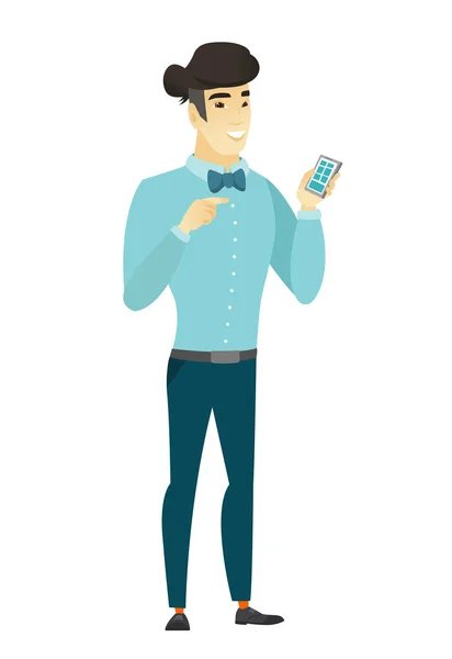 Asiático hombre de negocios sosteniendo un teléfono móvil . — Vector de stock