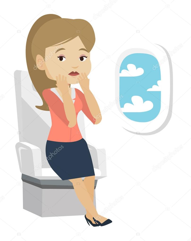 Young woman suffering from fear of flying.