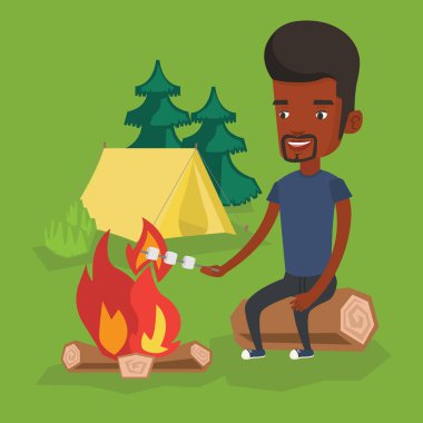 Adam kavurma Marshmallow kamp ateşi üzerinde.