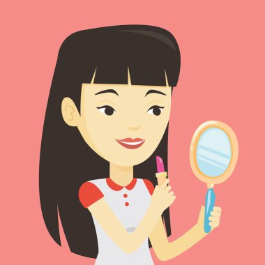 Gülen asyalı kadın makyaj yapıyor