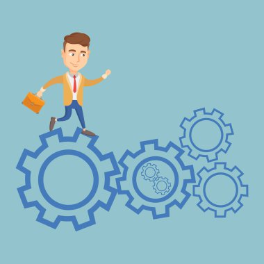 Cogwheels üzerinde çalışan iş adamı.