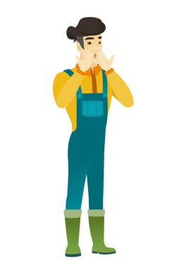 Ağzını kapsayan Shoked Asyalı çiftçi.