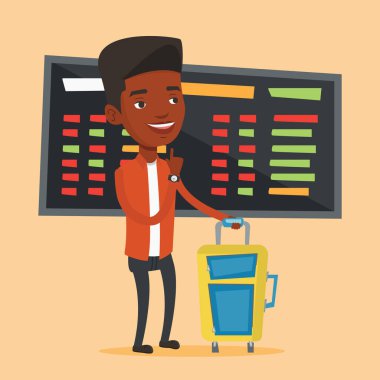 Havaalanında uçuş için bekleyen genç adam.