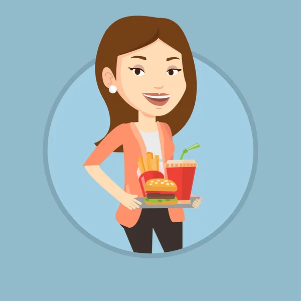 Mujer sosteniendo bandeja llena de comida rápida . — Vector de stock