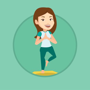 Genç kadın Yoga ağaç poz pratik.