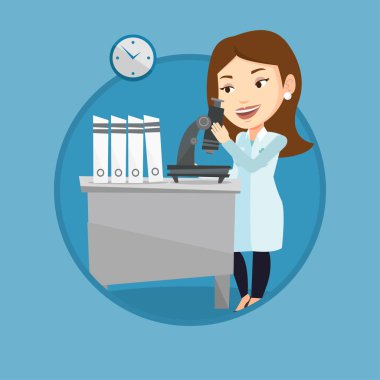 Laboratuar asistanı ile mikroskop.