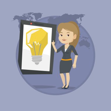 Büyük tablet bilgisayarda işaret eden kadın.