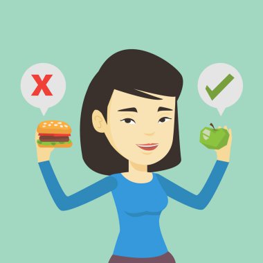 Kadın hamburger ve cupcake arasında seçim yapma.