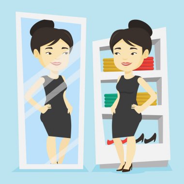 Kadın kıyafetleri soyunma odasında üzerinde çalışıyor.