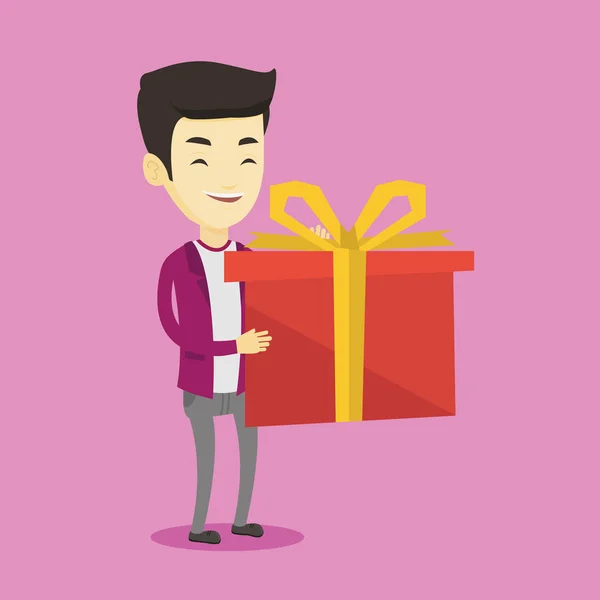 Χαρούμενη Ασίας άνθρωπος που κρατά το κουτί με δώρο. — Διανυσματικό Αρχείο