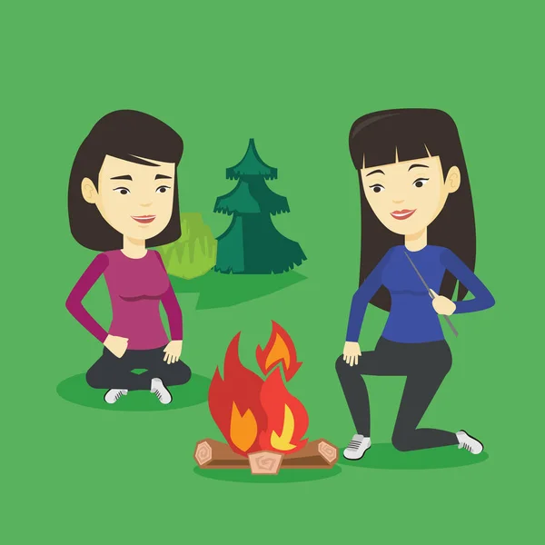 Dwóch przyjaciół siedząc wokół ogniska w camping. — Wektor stockowy