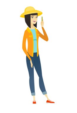 Kalem ile genç Asyalı çiftçi.