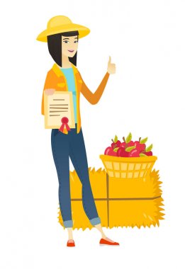 Bir sertifika tutan genç Asyalı çiftçi.