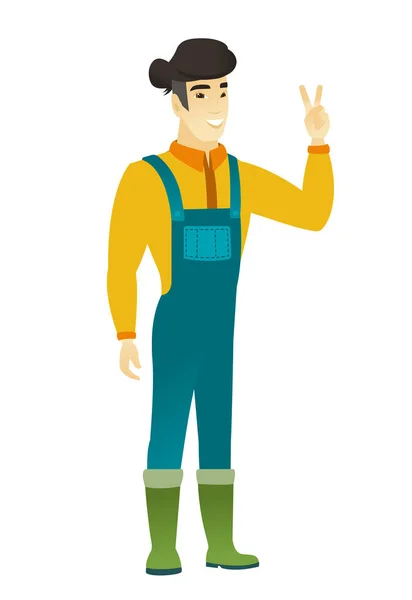 Asian farmer showing the victory gesture. — Stock Vector