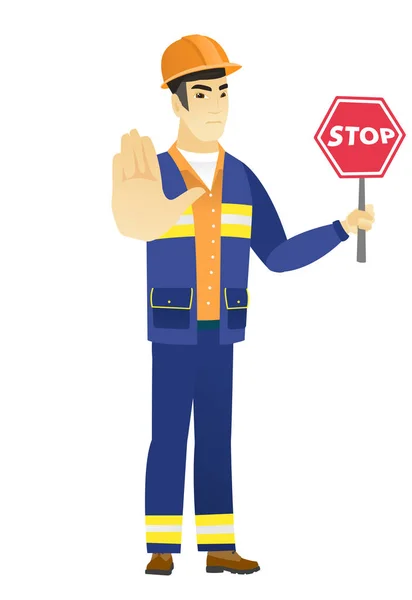 Asiático construtor segurando stop road sign . —  Vetores de Stock