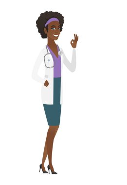 Ok işaret gösteren doktor gülümseyen.