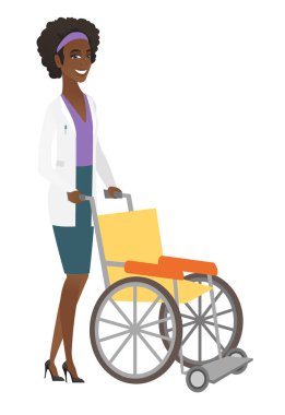 Afrikalı-Amerikalı doktor iterek boş tekerlekli sandalye.
