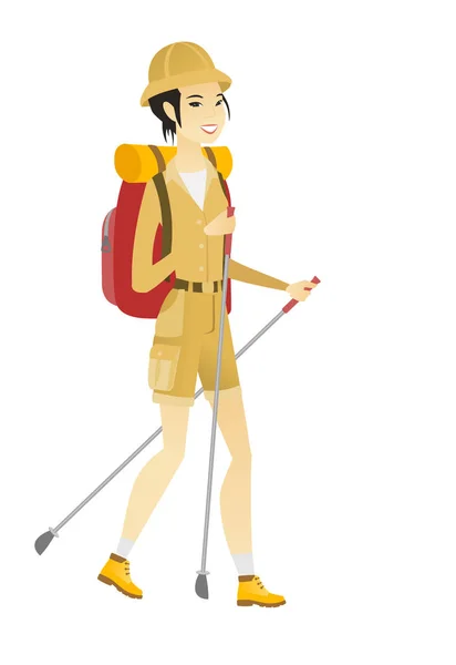 Mujer asiática excursionista caminando con bastones de trekking . — Vector de stock