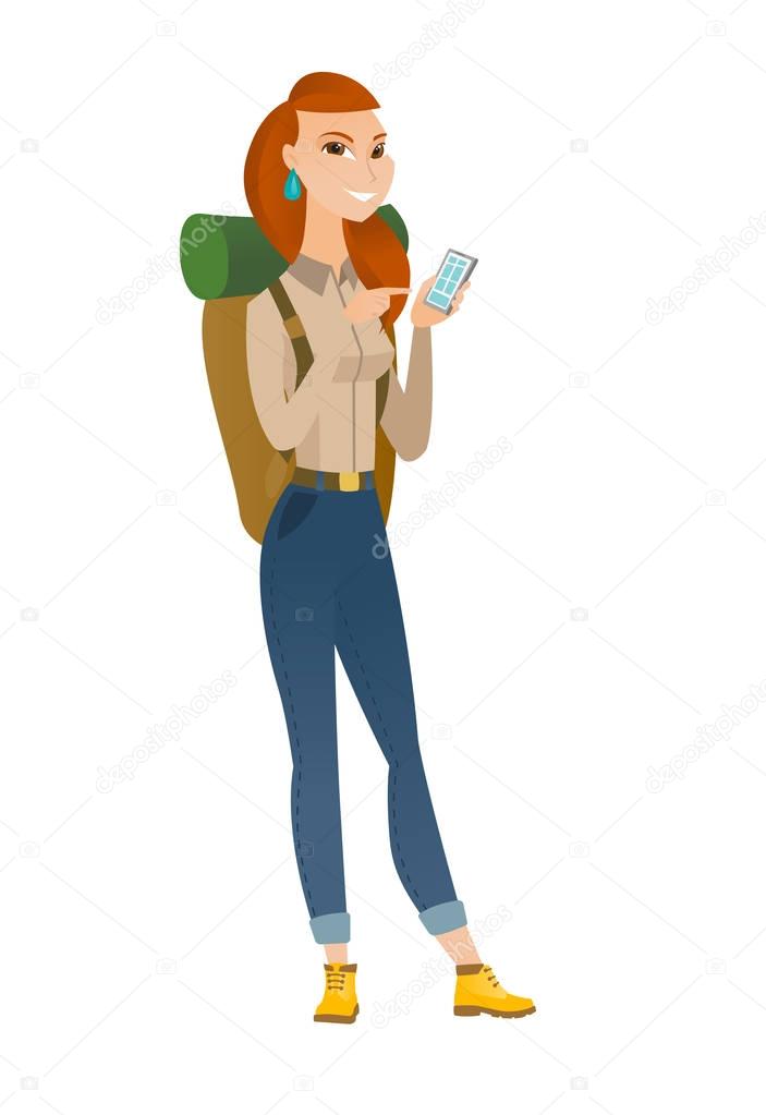 Caucasian traveler holding a mobile phone.