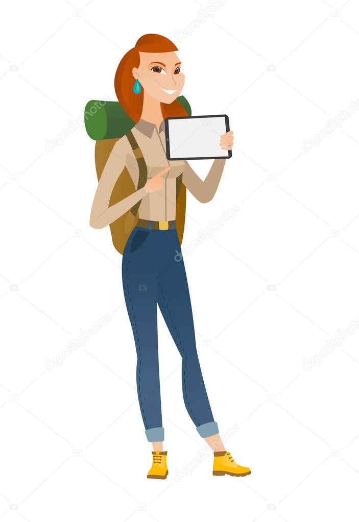 Smiling traveler holding tablet computer.
