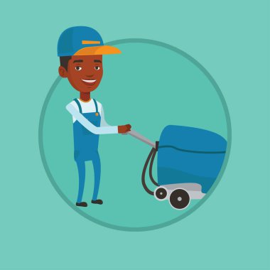 Erkek işçi deposu zemin temizleme makinesi ile.