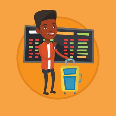 Havaalanında uçuş için bekleyen genç adam.