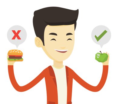 Adam hamburger ve cupcake arasında seçim yapma.